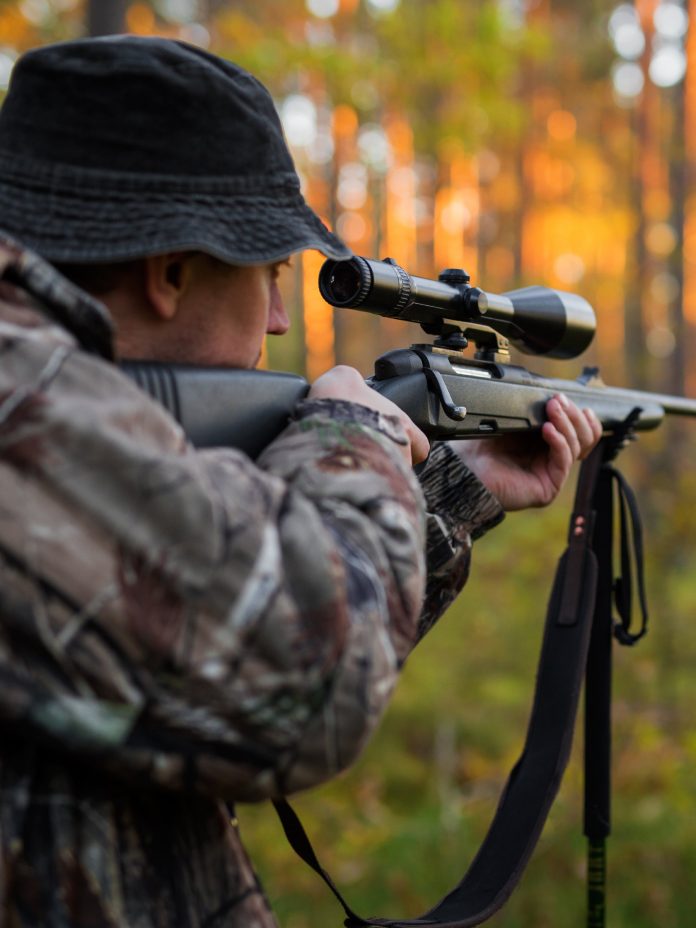 RiverAdventuresInc-362228-Man-Rifle-Forest-Image1.jpg